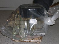 Cardboard base for carburetor to rest on