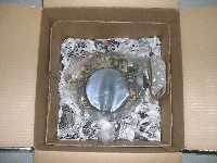 Wadded newspaper surrounding carburetor