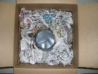Wadded newspaper surrounding carburetor